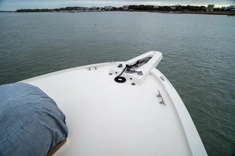  Yacht Photos Pics Bow view of 1984 Hatteras 52 Convertible yacht on calm waters.