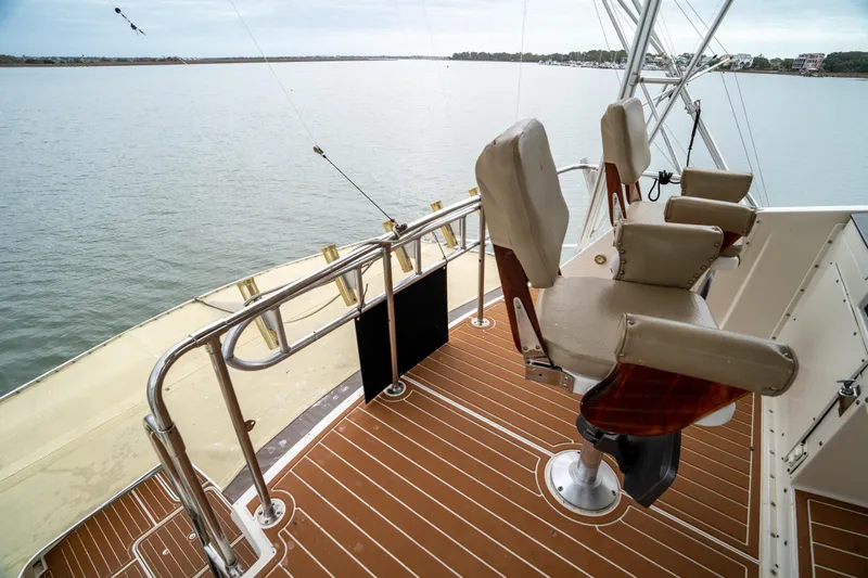  Yacht Photos Pics 1984 Hatteras 52 Convertible yacht deck with fishing chairs and ocean view.