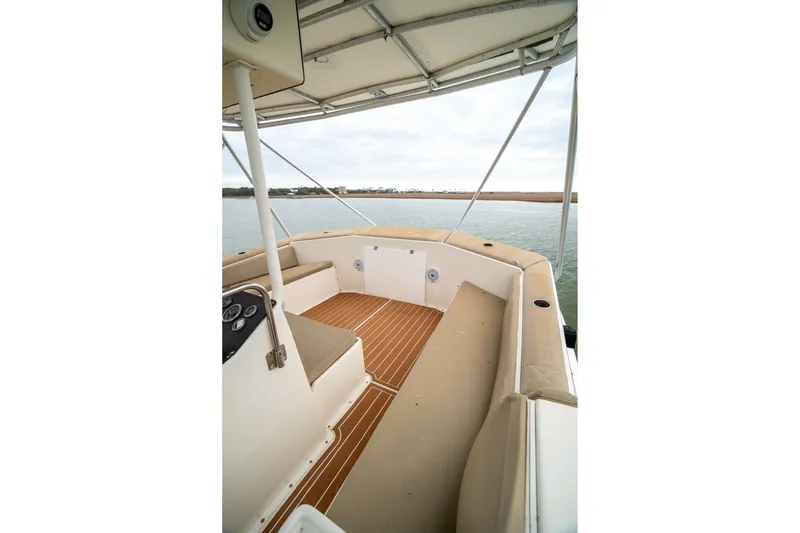  Yacht Photos Pics 1984 Hatteras 52 Convertible boat deck with seating and water view.