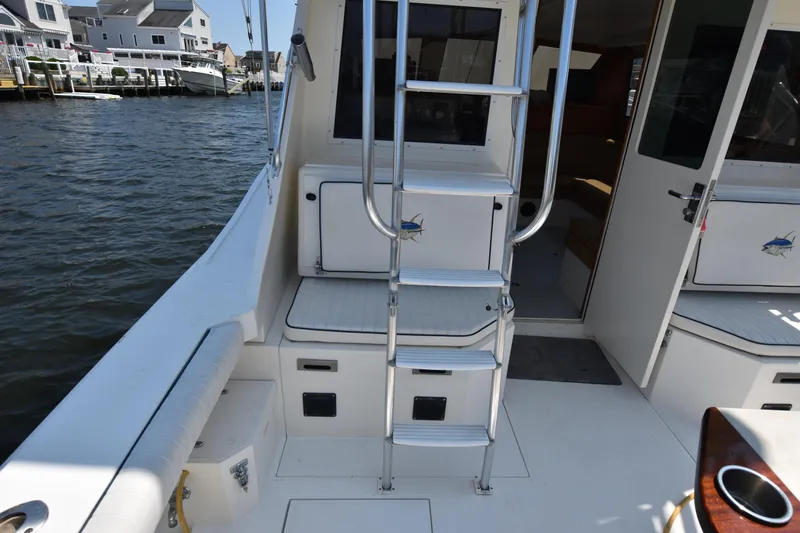  Yacht Photos Pics 1994 Cabo 35 Flybridge Sportfisher boat interior with ladder and seating.