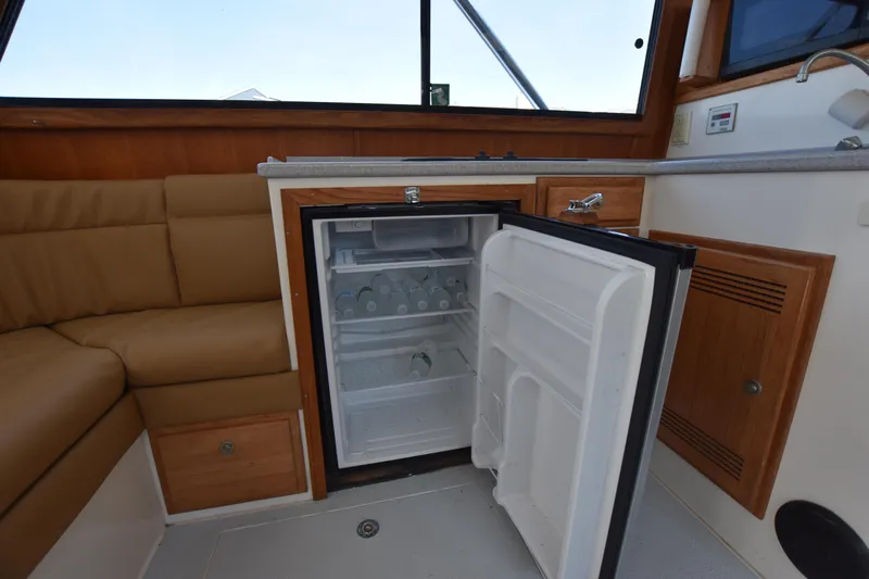  Yacht Photos Pics Open refrigerator in the cabin of a 1994 Cabo 35 Flybridge Sportfisher boat.
