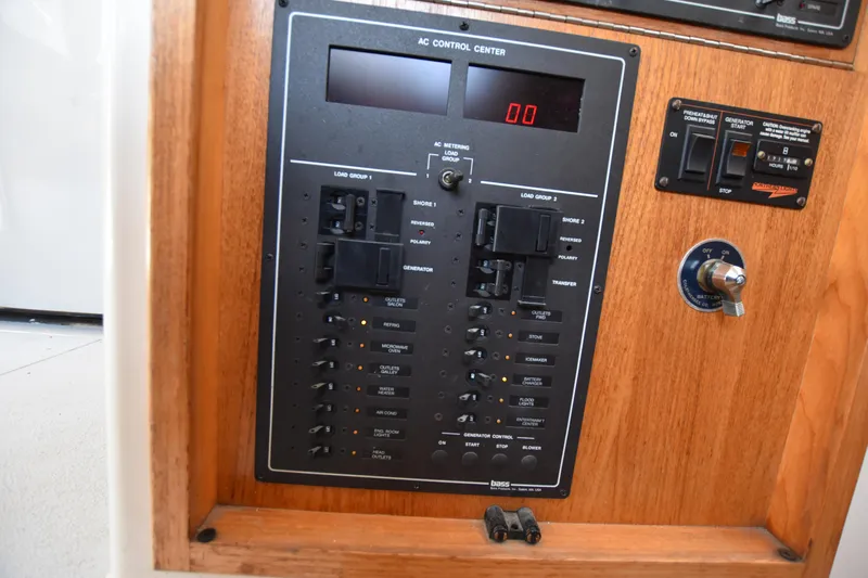  Yacht Photos Pics AC control panel of a 1994 Cabo 35 Flybridge Sportfisher boat.