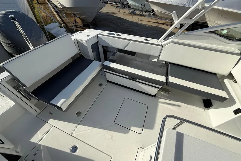  Yacht Photos Pics 2019 Blackfin 272 DC boat interior with white seating and storage compartments.