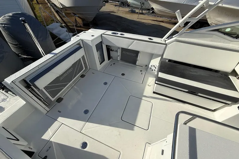  Yacht Photos Pics 2019 Blackfin 272 DC boat interior with seating and storage compartments.