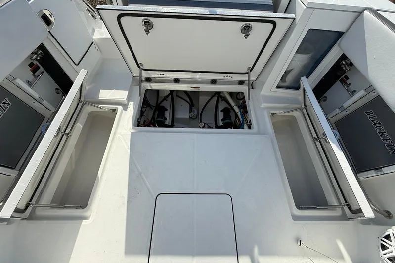  Yacht Photos Pics 2019 Blackfin 272 DC boat storage compartments open, showcasing interior space and design.