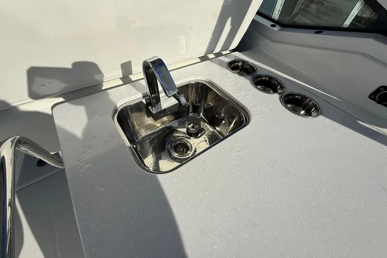  Yacht Photos Pics Stainless steel sink and cup holders on 2019 Blackfin 272 DC boat.