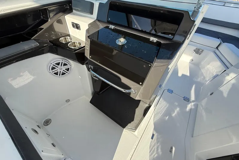  Yacht Photos Pics 2019 Blackfin 272 DC boat interior with storage, cup holders, and speaker.