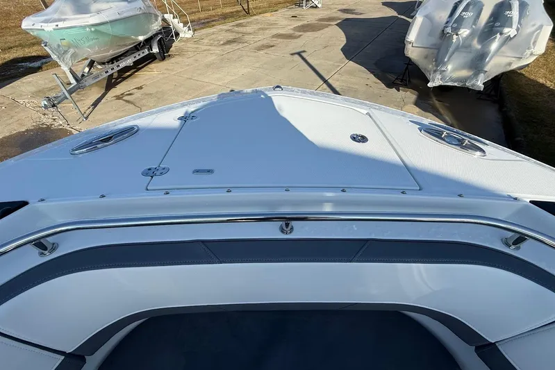 Yacht Photos Pics 2019 Blackfin 272 DC boat bow view, docked with other boats nearby.