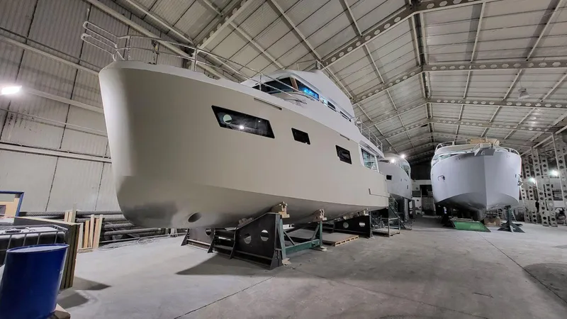  Yacht Photos Pics 2026 Cormorant Yachts COR55 RAV PURE NAVIGATOR in a spacious shipyard.