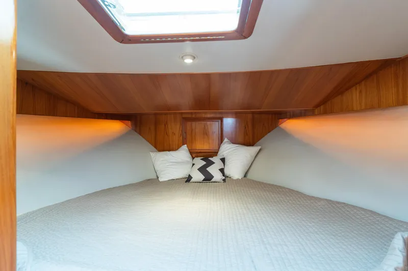 One Moor Day Yacht Photos Pics Cozy cabin interior of 1993 Ocean Alexander 440 yacht with wood paneling and skylight.