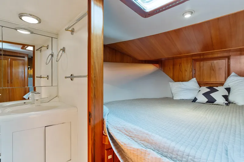 One Moor Day Yacht Photos Pics Cozy cabin interior of 1993 Ocean Alexander 440 yacht with bed and vanity.