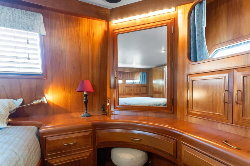 One Moor Day Yacht Photos Pics Luxurious wooden interior of 1993 Ocean Alexander 440 yacht cabin with mirror and lamp.