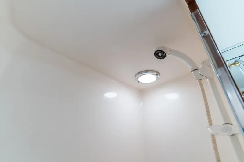 One Moor Day Yacht Photos Pics Shower area in 1993 Ocean Alexander 440 yacht, featuring modern fixtures and lighting.