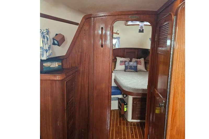 Water Dance Yacht Photos Pics 1999 Island Packet 350 yacht interior with wooden finish and cozy cabin.