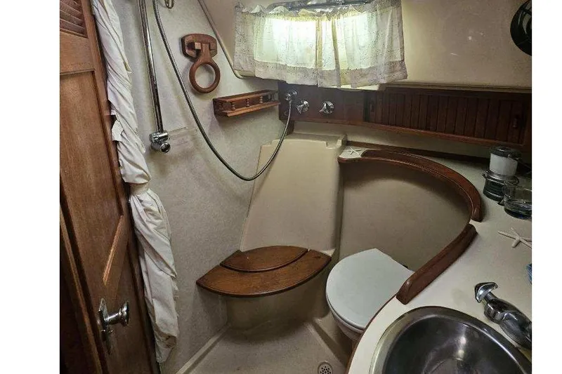 Water Dance Yacht Photos Pics 1999 Island Packet 350 yacht bathroom with shower, toilet, and sink.