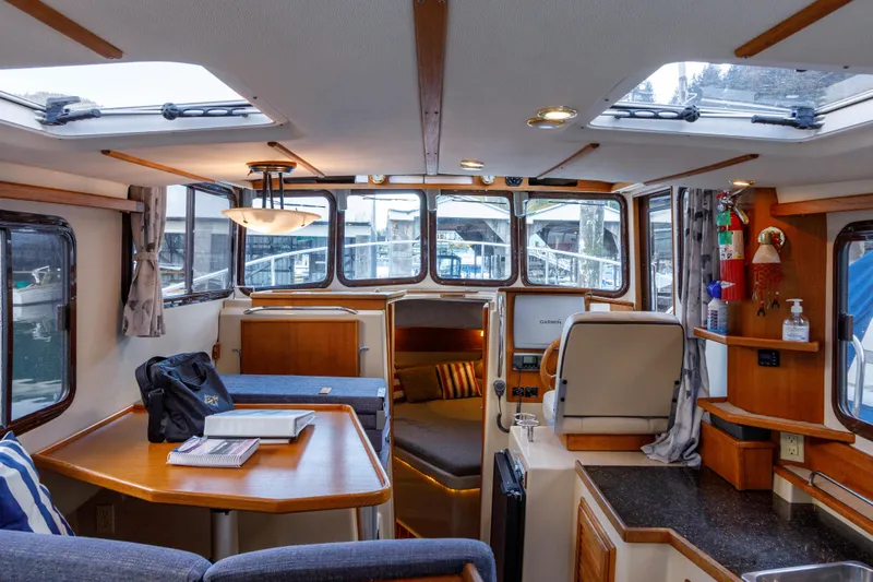  Yacht Photos Pics Interior of 2010 Ranger Tugs R-29 Sedan Luxury Edition, featuring cozy seating and modern amenities.