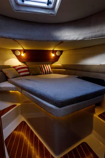  Yacht Photos Pics Cozy cabin interior of 2010 Ranger Tugs R-29 Sedan Luxury Edition with ambient lighting.