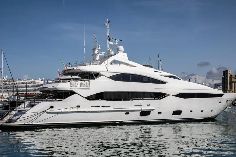  Yacht Photos Pics Luxurious 2014 Sunseeker 40 Metre Yacht docked in a marina under clear skies.