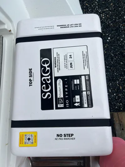 Kindred Spirit Yacht Photos Pics Seago life raft on Jeanneau Sun Odyssey 45 DS, 2008 model, with "No Step" warning.