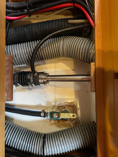 Kindred Spirit Yacht Photos Pics Engine compartment of 2008 Jeanneau Sun Odyssey 45 DS sailboat, showing hoses and mechanical components.