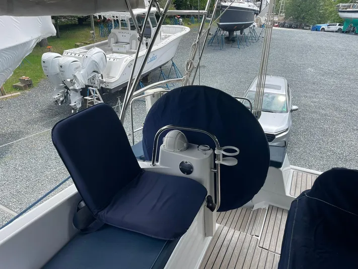 Kindred Spirit Yacht Photos Pics 2008 Jeanneau Sun Odyssey 45 DS cockpit with navy cushions and steering wheel.