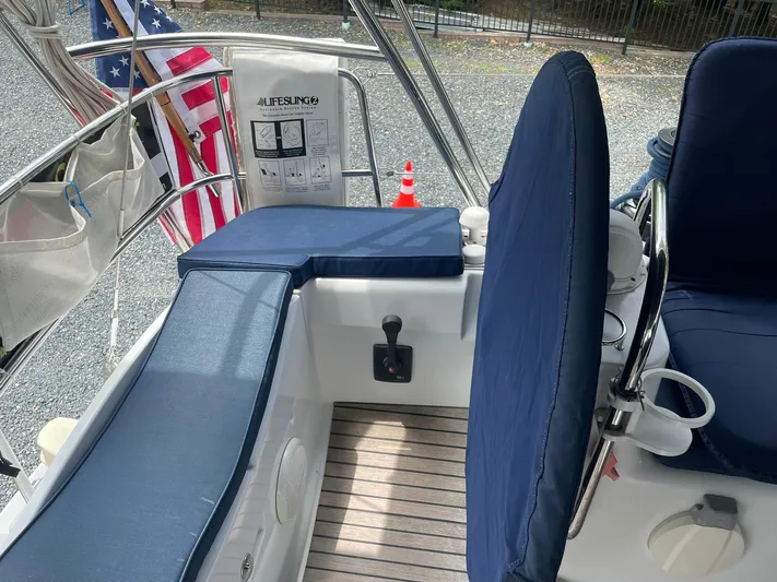 Kindred Spirit Yacht Photos Pics Cockpit of 2008 Jeanneau Sun Odyssey 45 DS with blue cushions and American flag.