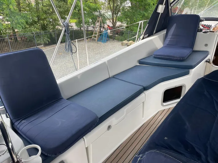 Kindred Spirit Yacht Photos Pics Jeanneau Sun Odyssey 45 DS 2008 cockpit with blue cushions and teak flooring.