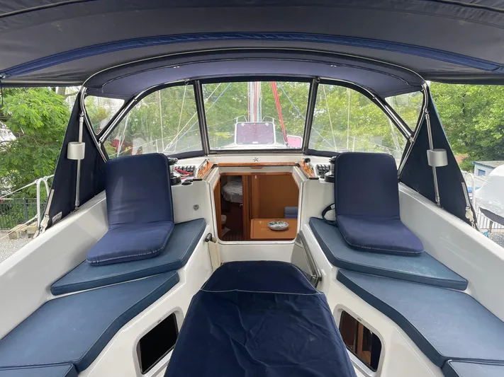 Kindred Spirit Yacht Photos Pics 2008 Jeanneau Sun Odyssey 45 DS cockpit with blue cushions and canopy.