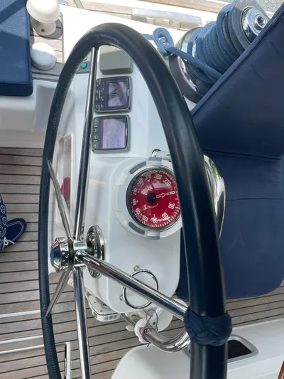 Kindred Spirit Yacht Photos Pics Steering wheel and compass on 2008 Jeanneau Sun Odyssey 45 DS sailboat.