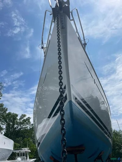 Kindred Spirit Yacht Photos Pics 2008 Jeanneau Sun Odyssey 45 DS sailboat with anchor chain, under a blue sky.