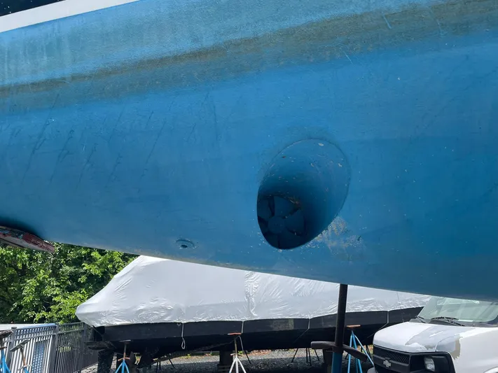 Kindred Spirit Yacht Photos Pics 2008 Jeanneau Sun Odyssey 45 DS hull with visible bow thruster, in dry dock.