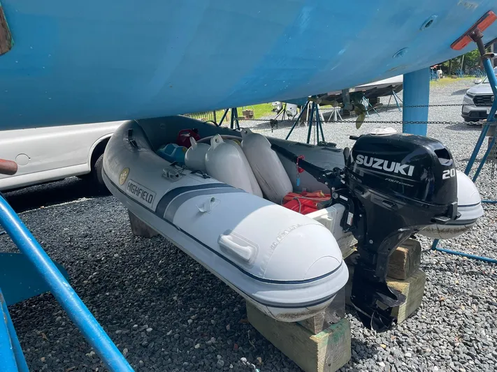 Kindred Spirit Yacht Photos Pics Inflatable dinghy with Suzuki outboard motor under Jeanneau Sun Odyssey 45 DS, 2008 model.