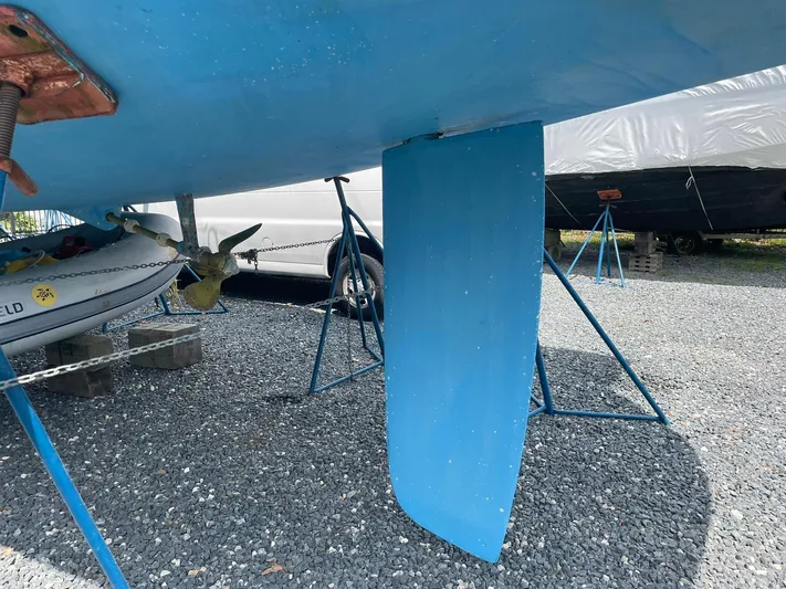 Kindred Spirit Yacht Photos Pics 2008 Jeanneau Sun Odyssey 45 DS sailboat keel on gravel, supported by stands.