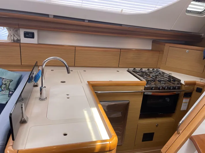 Kindred Spirit Yacht Photos Pics Modern kitchen in 2008 Jeanneau Sun Odyssey 45 DS yacht with stove and sink.