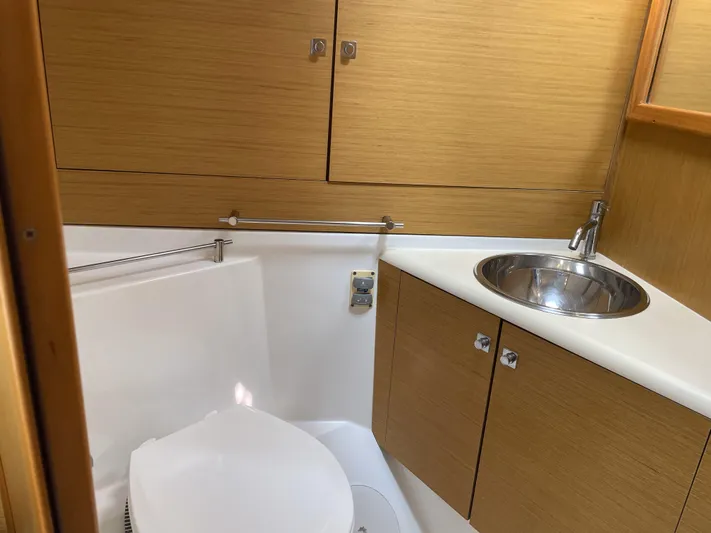 Kindred Spirit Yacht Photos Pics Bathroom interior of 2008 Jeanneau Sun Odyssey 45 DS yacht, featuring sink and toilet.