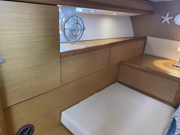 Kindred Spirit Yacht Photos Pics Interior cabin of 2008 Jeanneau Sun Odyssey 45 DS yacht with wooden finish.
