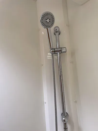 Kindred Spirit Yacht Photos Pics Shower area in 2008 Jeanneau Sun Odyssey 45 DS sailboat, featuring adjustable showerhead.