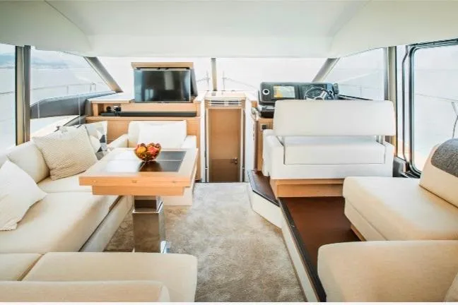  Yacht Photos Pics Luxurious interior of a 2018 Prestige 520 yacht with modern furnishings and panoramic windows.