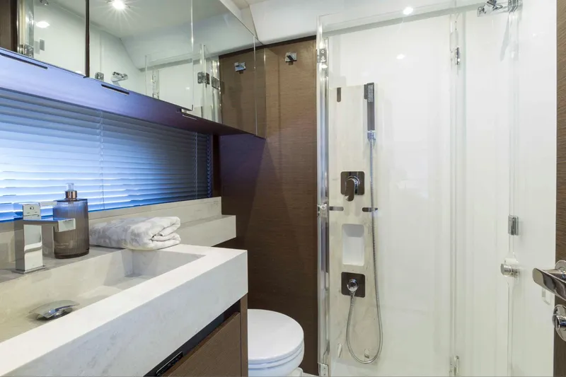  Yacht Photos Pics Luxurious bathroom interior of 2018 Prestige 520 yacht with modern fixtures and elegant design.