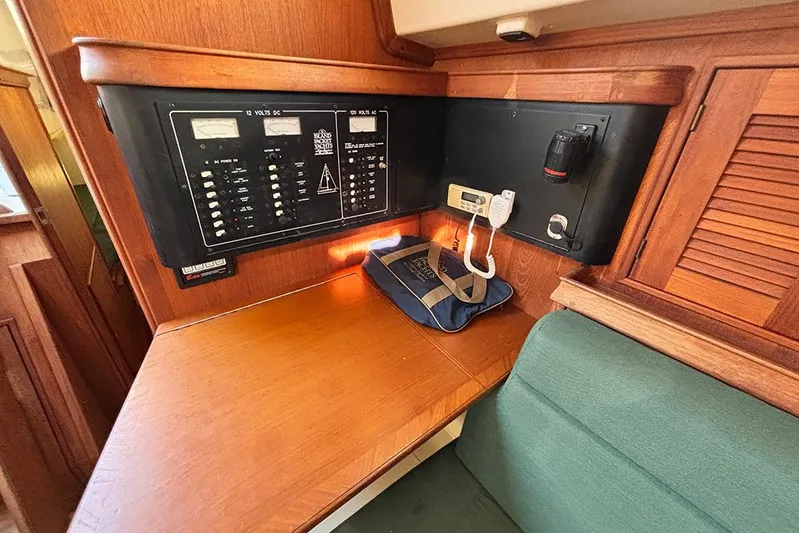 Butternut Yacht Photos Pics Navigation station of a 1995 Island Packet 37 sailboat with control panels and equipment.