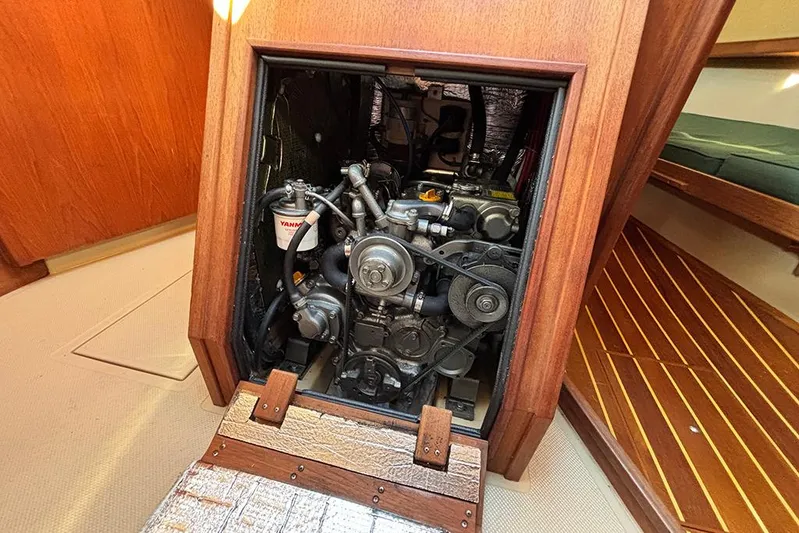 Butternut Yacht Photos Pics Engine compartment of a 1995 Island Packet 37 sailboat, featuring a Yanmar engine.
