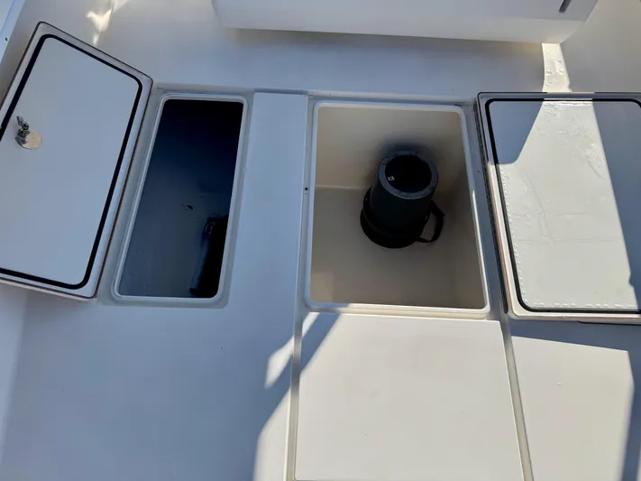 Fast Forward Yacht Photos Pics 2010 Contender 39 ST boat storage compartments with open hatches.