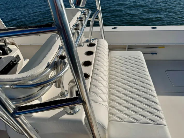 Fast Forward Yacht Photos Pics 2010 Contender 39 ST boat interior with quilted seating and rod holders.