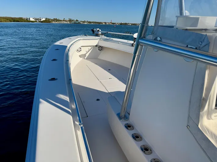 Fast Forward Yacht Photos Pics 2010 Contender 39 ST boat on calm water, showcasing spacious deck and sleek design.