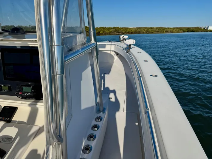 Fast Forward Yacht Photos Pics 2010 Contender 39 ST boat on calm water, featuring sleek design and modern equipment.