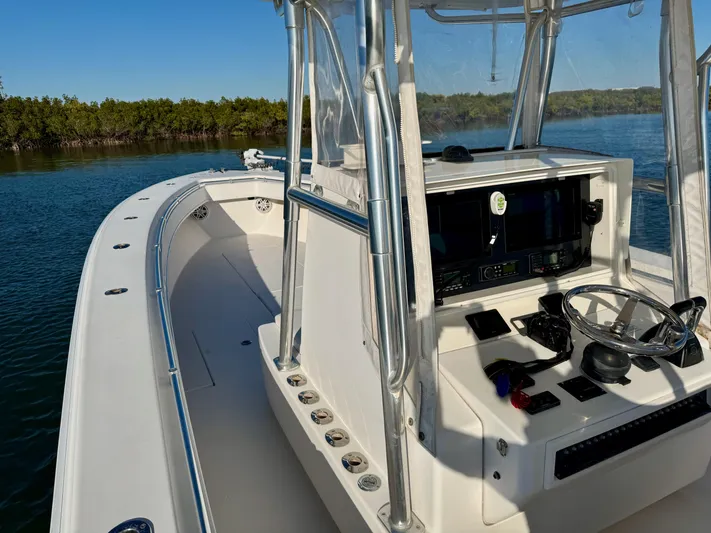 Fast Forward Yacht Photos Pics 2010 Contender 39 ST boat, sleek design, spacious deck, modern controls, cruising on calm waters.