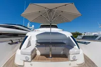 Luxurious 2016 Custom Line Navetta 28 yacht with shaded seating area on deck.