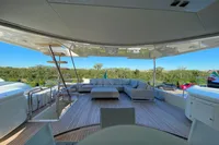 Luxurious 2016 Custom Line Navetta 28 yacht deck with modern seating and scenic view.