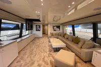 Luxurious interior of 2016 Custom Line Navetta 28 yacht with plush seating and modern decor.