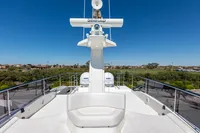 2016 Custom Line Navetta 28 yacht deck with seating and navigation equipment.